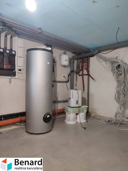 Heating in a family house with a storage tank and distribution system.