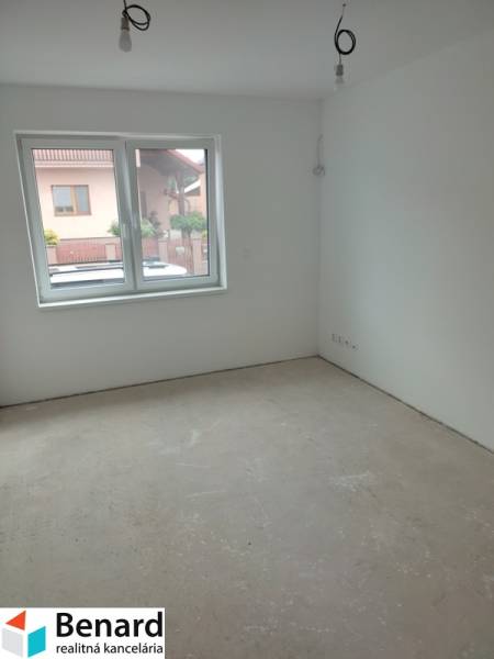 Empty room in a family house with a window on the ground floor.
