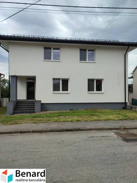 A family house on Nezabudova Street in Sabinov with a white facade and a gray roof.