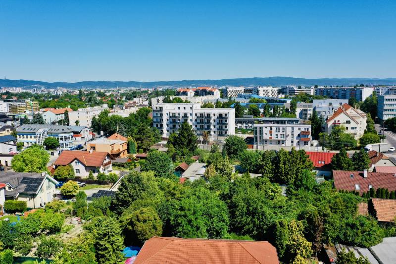 View of greenery and buildings in Bratislava - Podunajské Biskupice, Geologická Street.