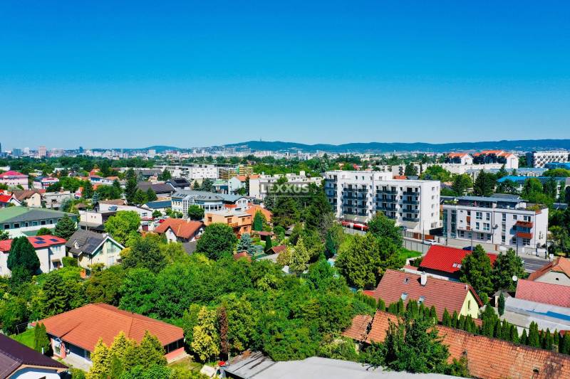 Aerial view of houses and greenery in Bratislava - Podunajské Biskupice on Geologická Street.
