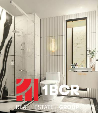 Bathroom in a 2-room apartment with a shower, toilet, and sink; bright elegant features.