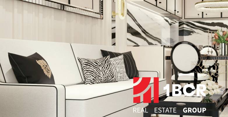 Luxury furnishing of a 2-room apartment with designer cushions and elegant details.