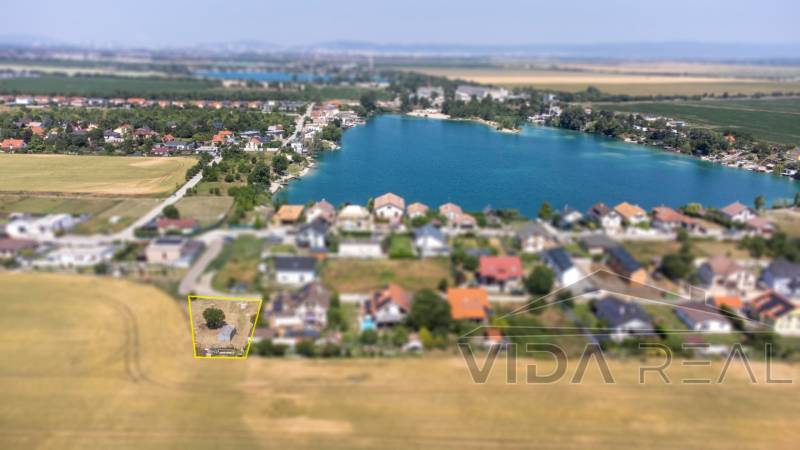 Aerial view of the cottage area near the water body in Dunajská Lužná, Land - housing.