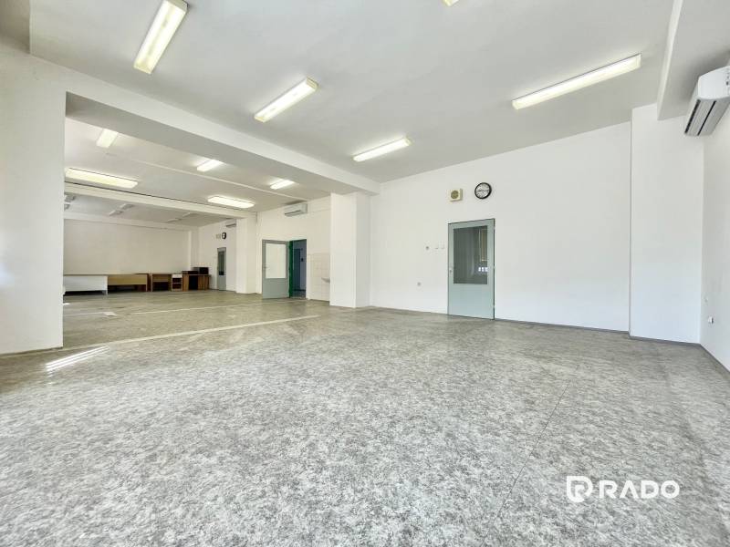 Spacious offices with white walls and lighting, ideal for work purposes.