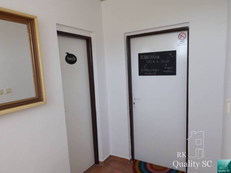 Interior of the building with doors to the toilet and a room for body balance, mirror.