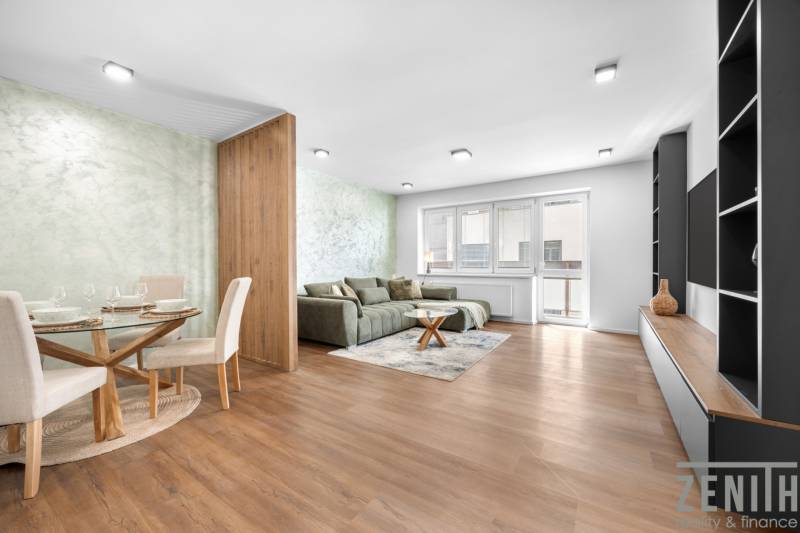 Living room in a 3-room apartment with a sofa, dining table, and modern furniture.