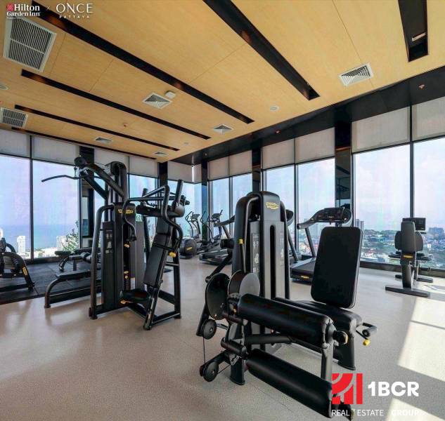 Fitness center in an apartment building with a view of Pattaya.