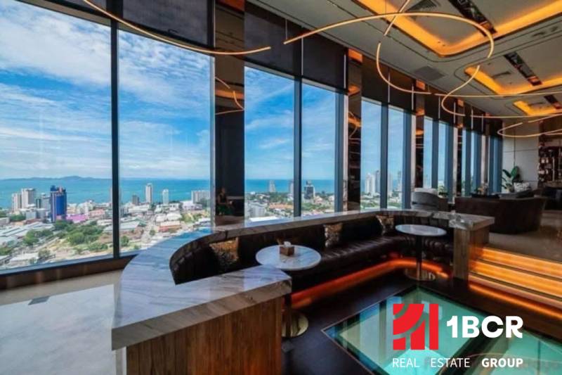 Interior with glass views of the panorama and sea within the construction of apartments.