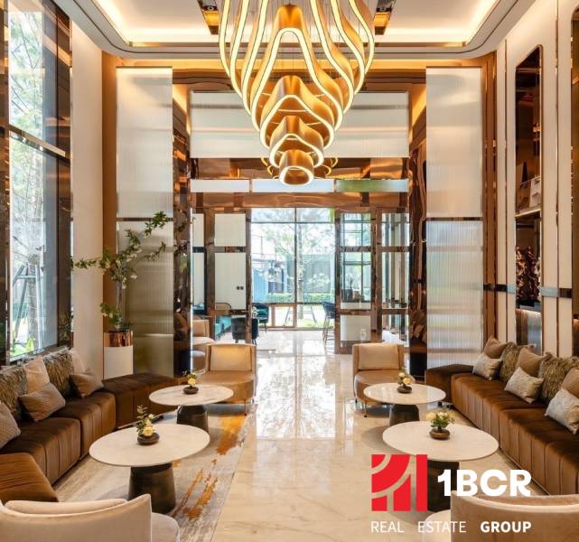 Luxurious interior with an elegant chandelier and comfortable seating for apartment construction.