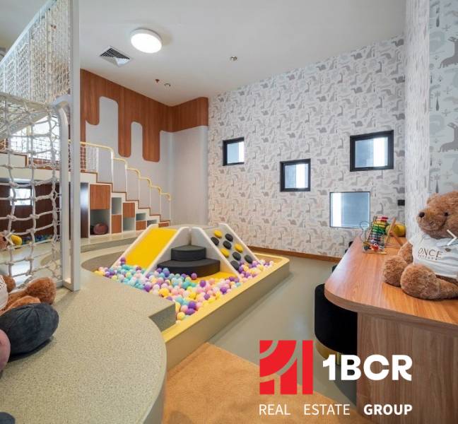 Children's corner with a ball pool and games as part of apartment construction.