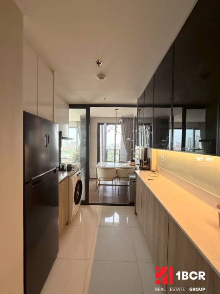 Kitchen in a 3-room apartment with a view of the dining area.