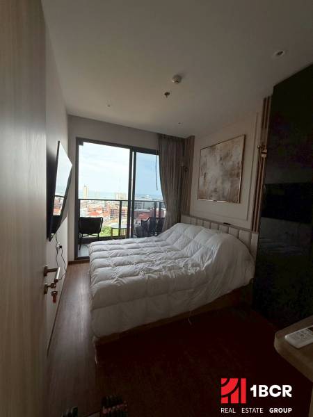 Bedroom with a bed and a view, 3-room apartment with a balcony.