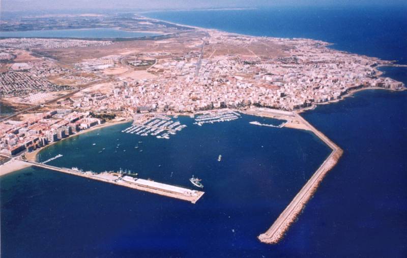 Aerial view of the coastline of Torrevieja with the harbor and surrounding landscape.