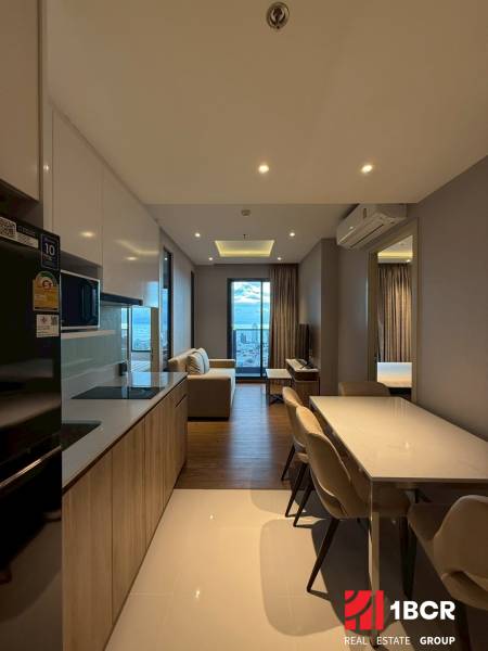 Kitchen and dining room in a 3-room apartment with a view from the balcony.