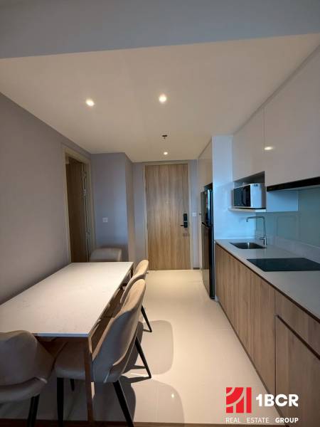 A kitchen in a 3-room apartment with a dining area and built-in appliances.