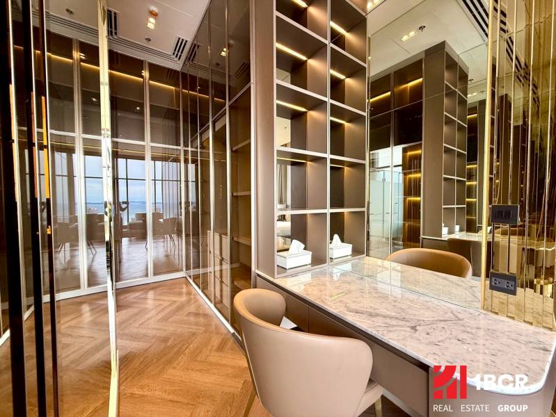 Luxury room with mirrored walls in a 4-room apartment, elegant wooden floor pattern.