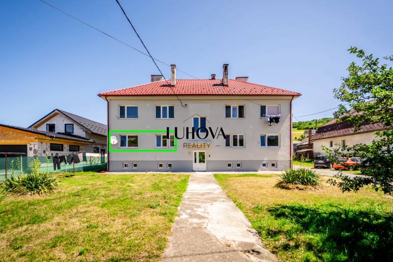 Two-story building with a garden in Púchov, offering a 2-bedroom apartment.