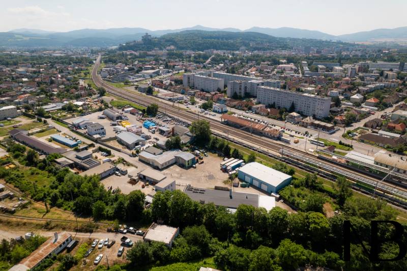 Aerial view of Trenčín, Kasárenská Street and Warehouses and Halls, with mountains in the background.