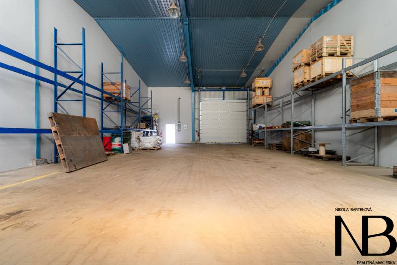 Interior of warehouses and halls with storage racks and wooden pallets.