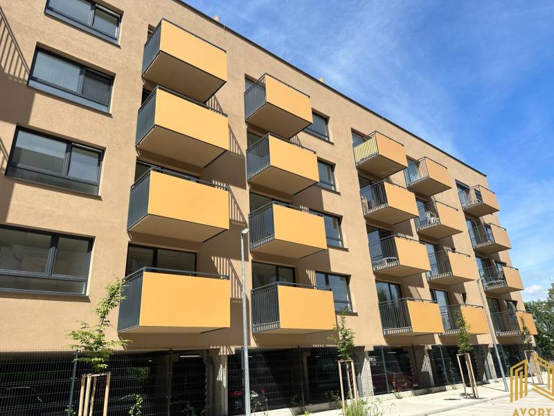 Apartment building with balconies on Sadova Street in Senica, near the garages.