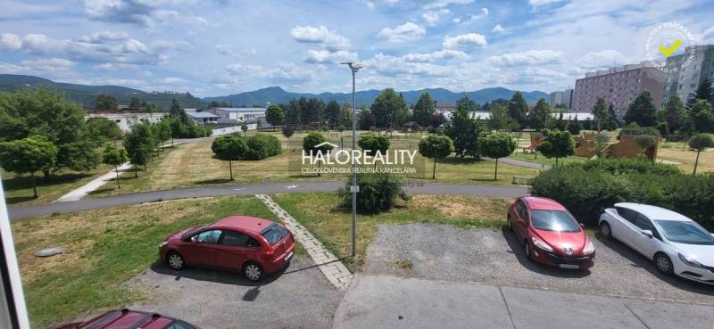 Parking lot and greenery with a view of the mountains in Žiar nad Hronom.