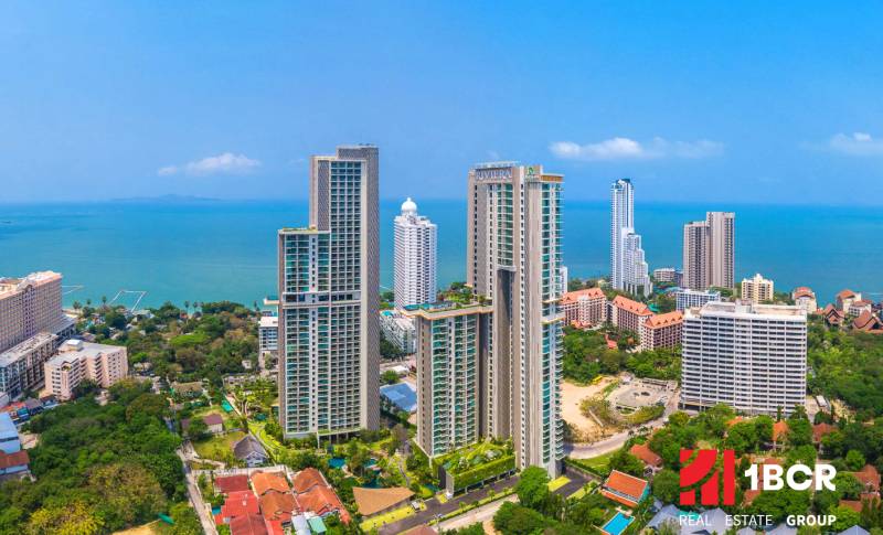 Apartment construction in Pattaya, high-rise buildings by the coast with a sea view.
