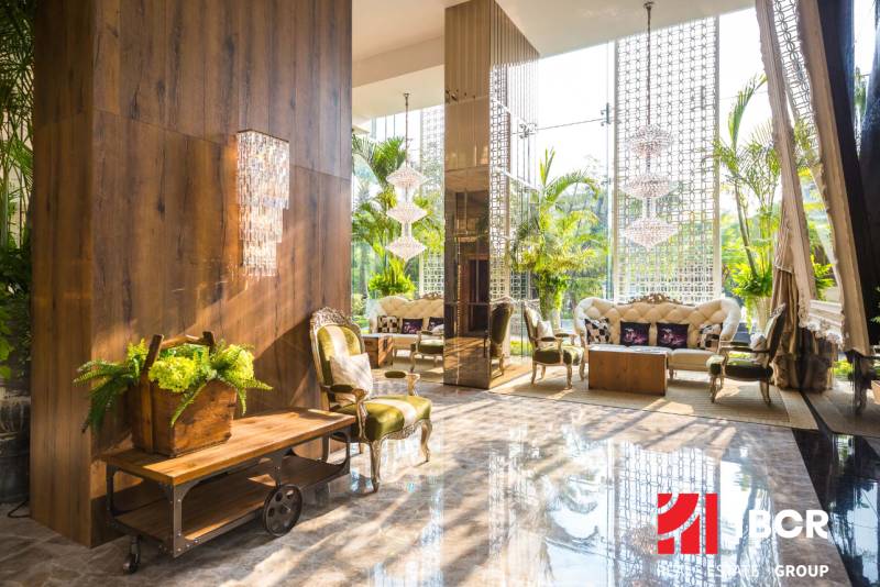 Luxurious interior with comfortable furniture and plants in apartment construction.