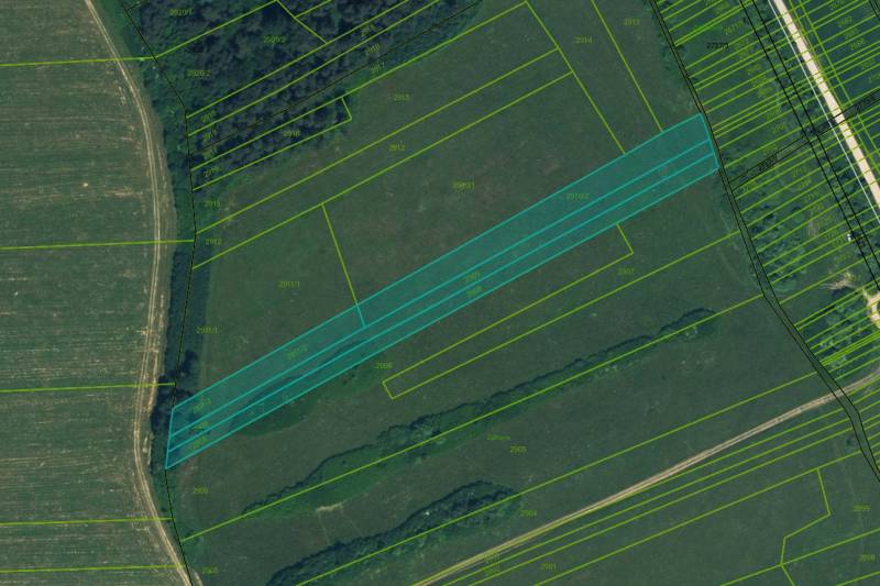 Aerial view of agricultural and forest lands around Sučany with parcel numbers.