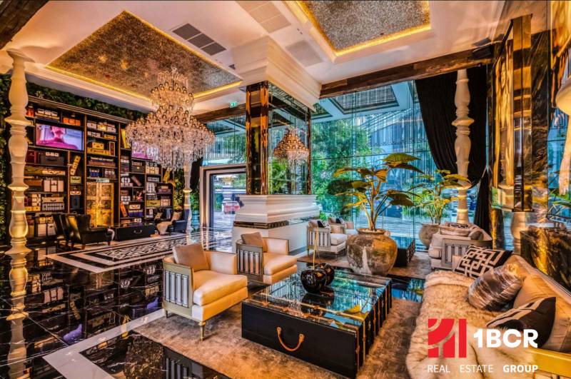 Luxurious living room with crystal chandeliers and comfortable seating, Apartment construction.