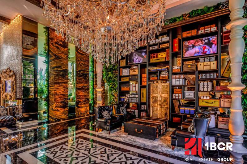 Luxury interior with a crystal chandelier and decorative elements in the context of apartment construction.