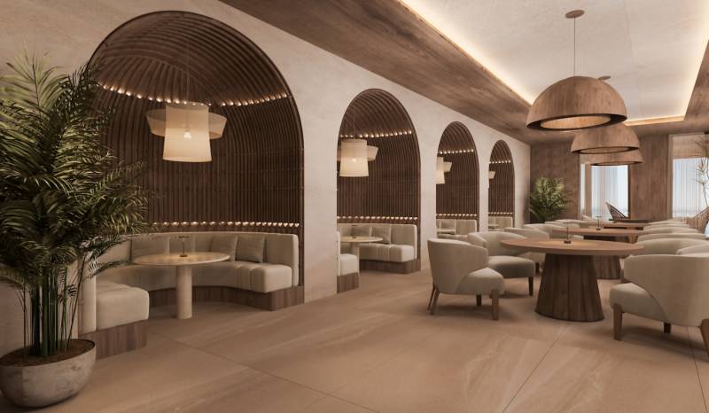 Interior of a family house with elegant armchairs, wooden tables, and interesting lighting.