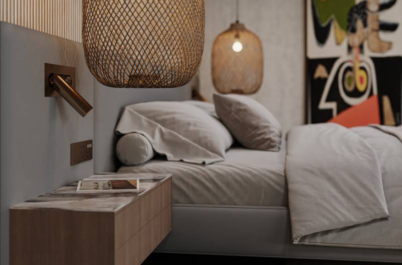 Bedroom in a family house with a bed, nightstand, and hanging lamps.