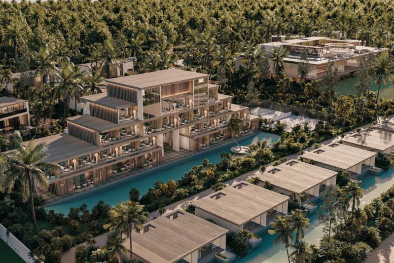 A resort surrounded by palm trees, pools, and modern buildings in the suburbs.