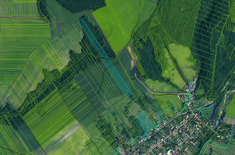 Aerial view of agricultural and forest lands around Ladomirová.