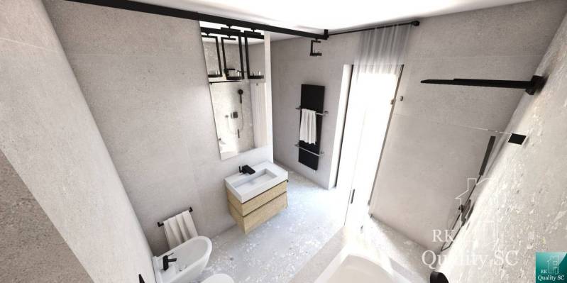 A bathroom in a family house with a sink, a mirror, and a towel rack.