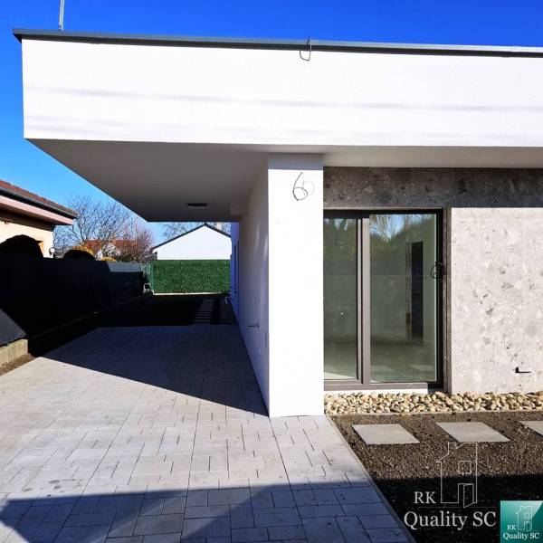 A family house in Turany with a spacious yard and glass doors.