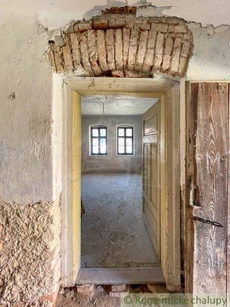 An old arched passage in the interior of a family house with original brickwork decoration.