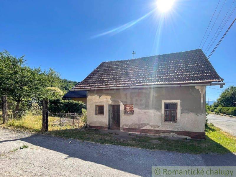A family house near Banská Bystrica with a traditional roof and a rural setting.