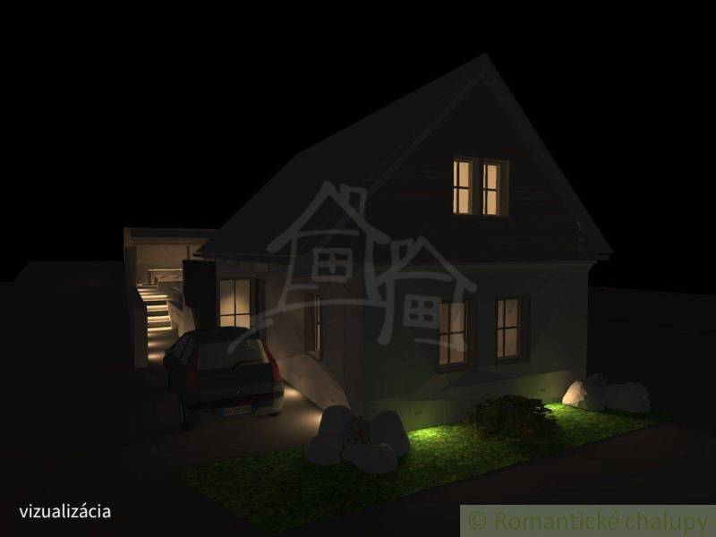 A night view of a family house in Banská Bystrica with an illuminated garden and staircase.