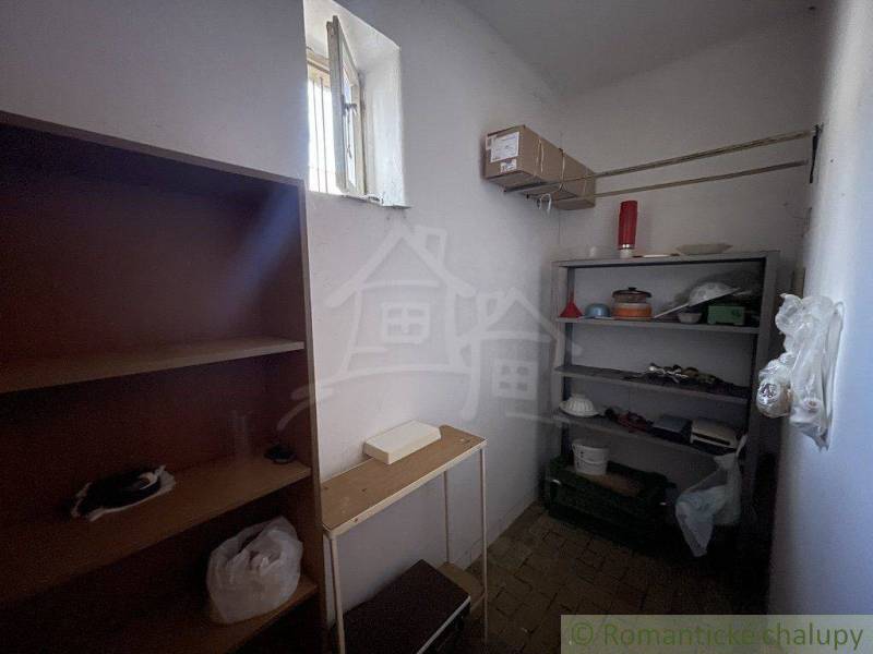 Storage space with shelves in a family house, suitable for storing items.