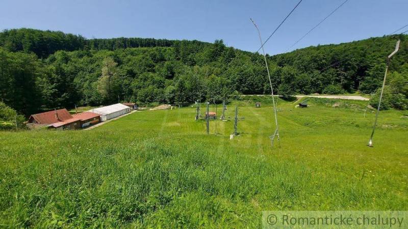 Green hills, forests, and a ski lift in the outdoor area near Stará Myjava.