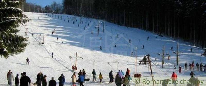 A ski slope in Stará Myjava with many skiers and a ski lift.