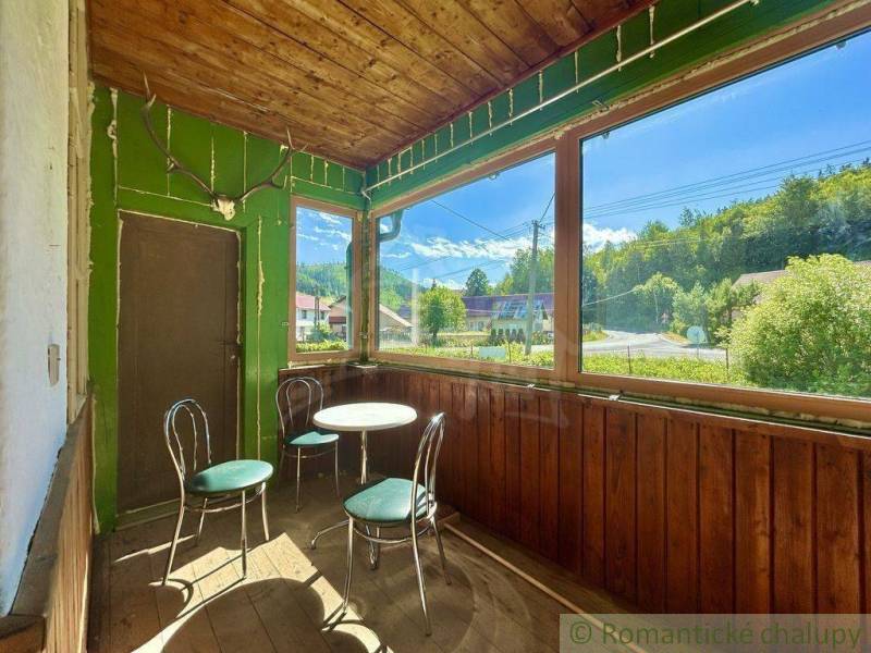 A glass-enclosed veranda in a family house with a view of the surroundings of Spišská Nová Ves.