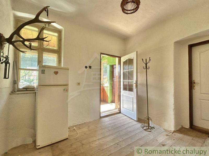 Interior of a family house with antique elements and simple furnishings.