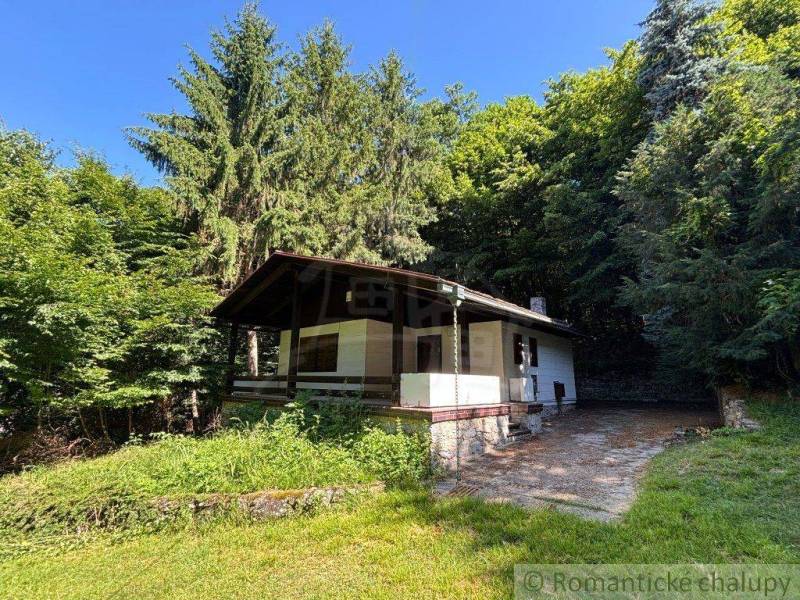 A family house in Malacky surrounded by dense forests and grassy environment.