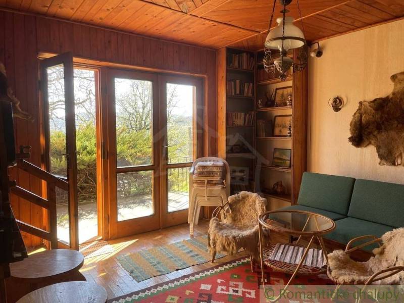 A cozy cottage interior with antique details and natural elements, ideal for Unique Properties.
