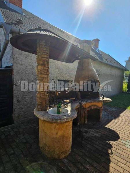 In Malá Lehota, near a family house, there is an outdoor fireplace with a stone sink.