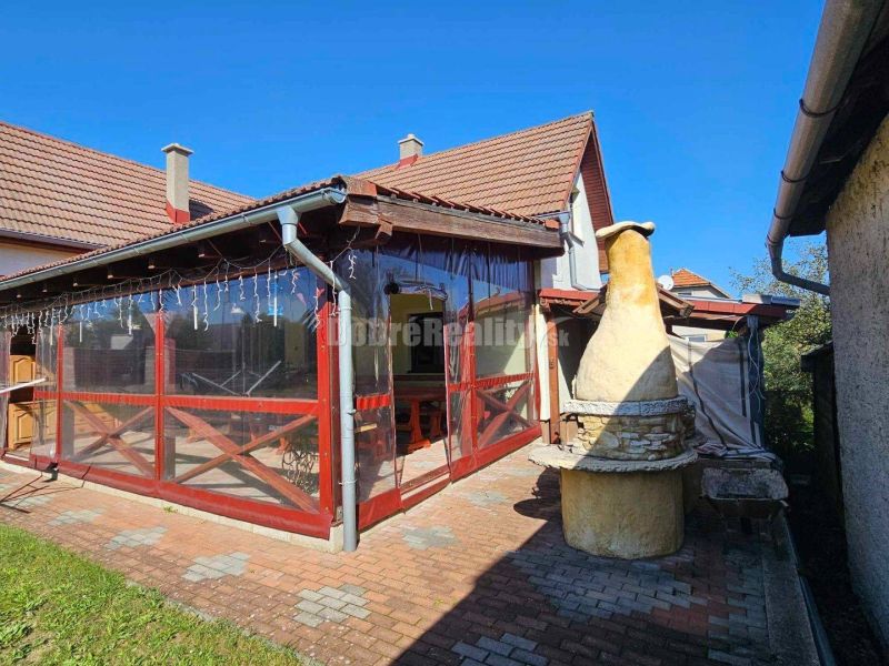 Terrace of a family house in Malá Lehota with a grill and paved surroundings.