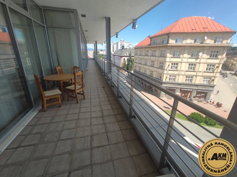 A balcony on J. Kotáčeka Street, overlooking the city of Zvolen and the surrounding offices.